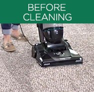 Person vacuuming carpet before deep cleaning